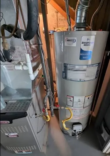 Harrisburg Water Heater Pros technician repairing a gas water heater in a Harrisburg PA home