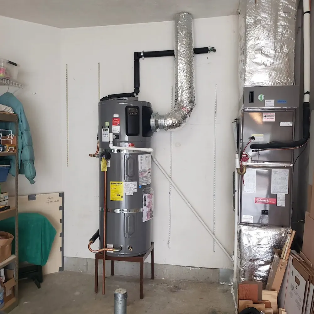 Rheem hybrid heat pump water heater with flexible air duct connected for repair in a Harrisburg PA basement