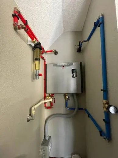 Harrisburg Water Heater Pros technician diagnosing a water heater in a Harrisburg PA basement