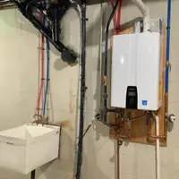 Wall-mounted tankless water heater installation in a Harrisburg PA home
