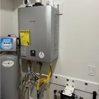 Tankless water heater being repaired in a Harrisburg PA home