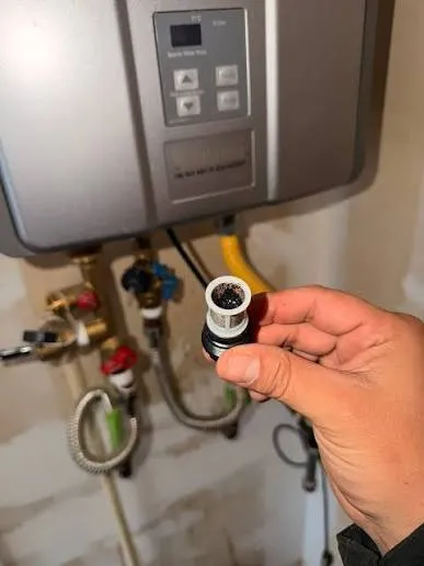 Technician diagnosing a water heater fault in a Harrisburg PA home