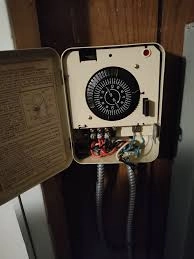 Electric water heater control panel with wiring connections in a Harrisburg PA home